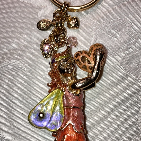 KIRK’S FOLLY gt fairy keychain holding heart with 4 sm. charms.    $25 - Picture 2 of 7